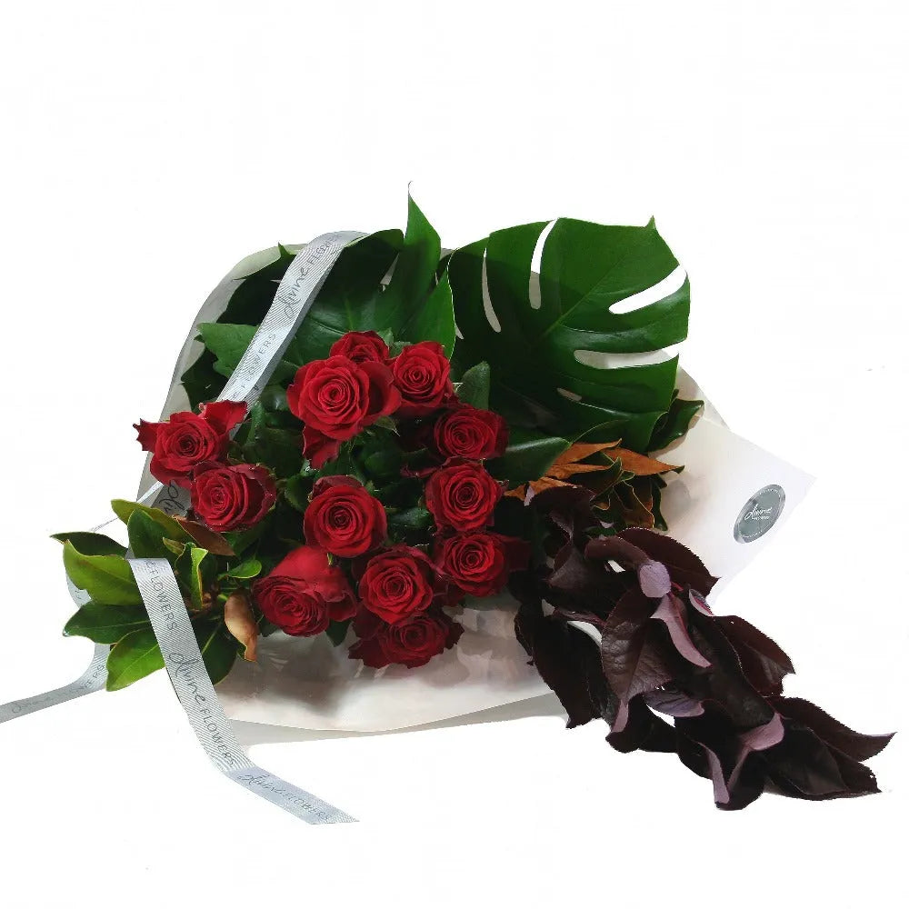 one dozen red roses gift wrapped